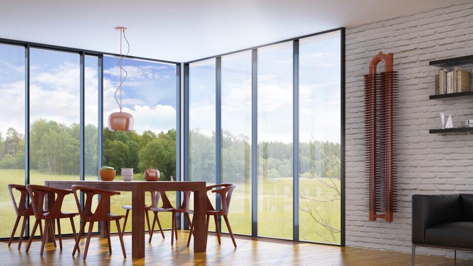 Modern eingerichtetes Esszimmer mit formschön gestaltetem Heizkörper