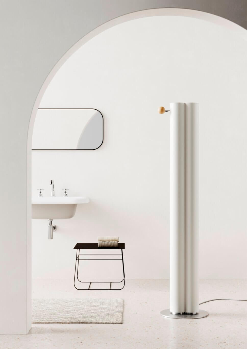 Modern eingerichtetes Badezimmer mit formschön gestaltetem Heizkörper